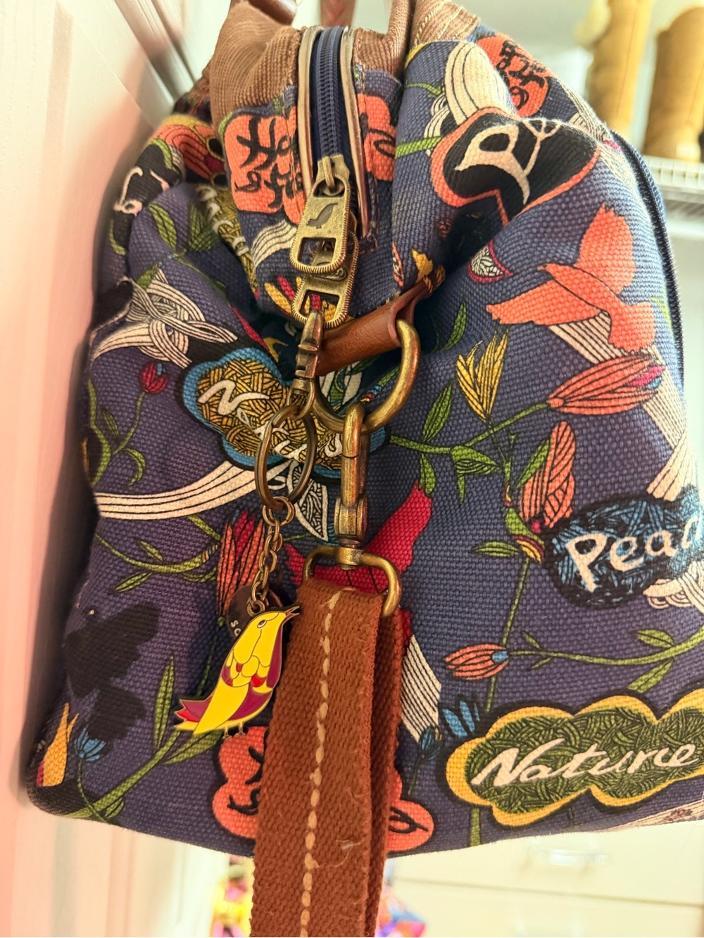 Sakroots Floral Peace Canvas Duffel Bag in Navy with Brown Trim - Picture 6 of 10